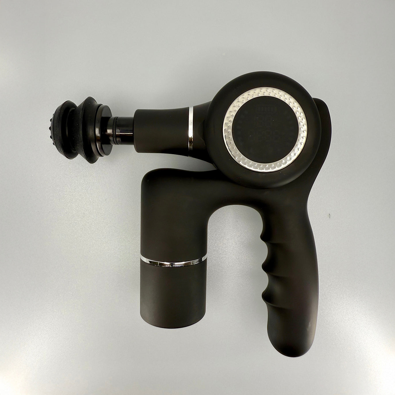 Black massage gun on a light gray background