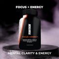 Supplement bottle labeled 'Focus + Energy' on a dark background
