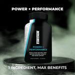 Black supplement bottle labeled 'Power + Performance' on a dark background