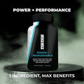 Black supplement bottle labeled 'Power + Performance' on a dark background